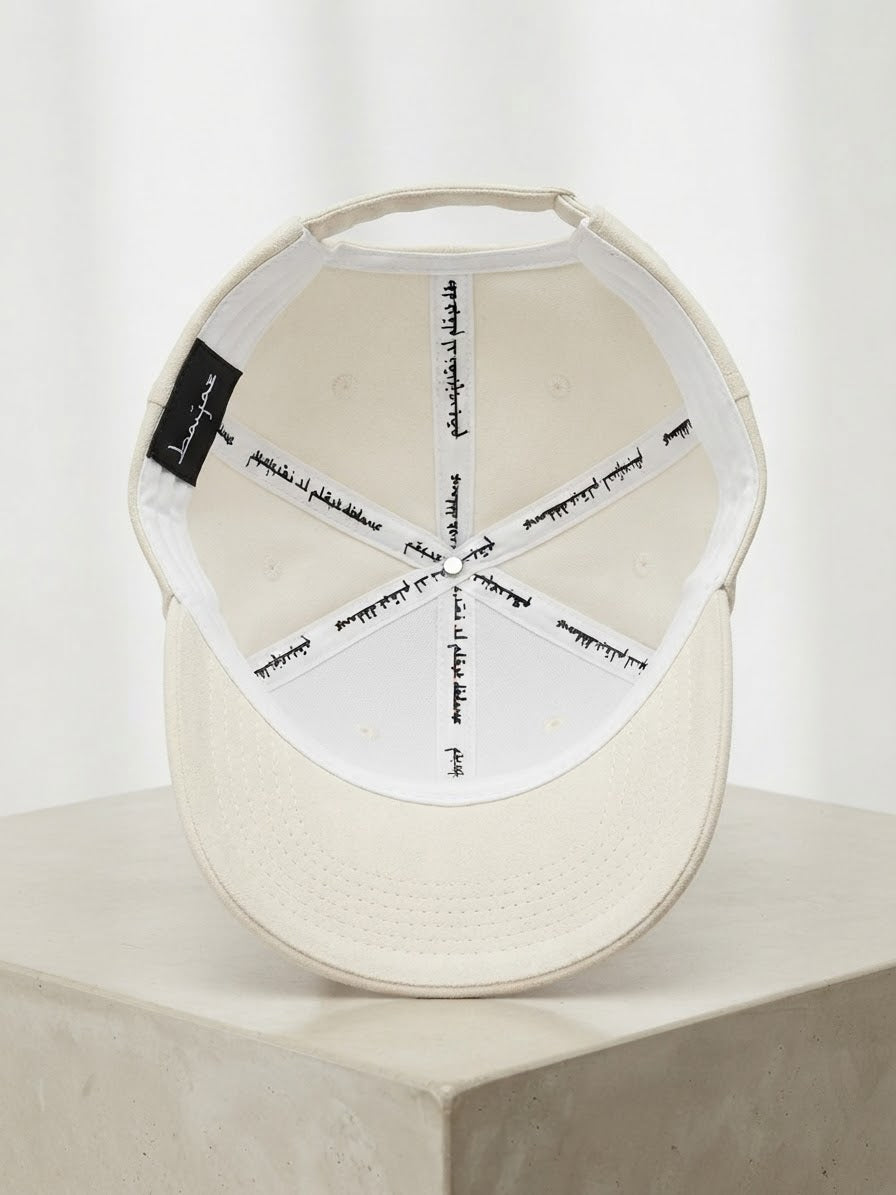 Casquette en daim blanc cassé "Pourquoi il pleut dedans"